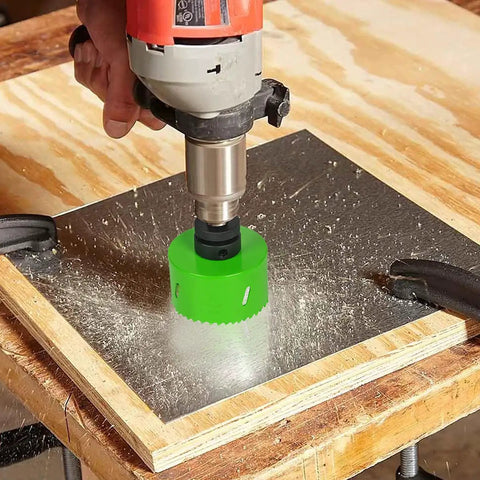 6-1/4 Inch Hole Saw With 6.25 Bit HSS Bi-Metal Cutter drilling into metal on wooden workbench