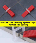 Tile Leveling System With One Sixteenth Inch Spacers And Clips, 2000 Pieces, shown on gray ceramic tile for even grout joints