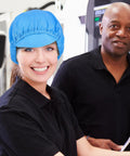 Five Piece Anti Static Work Caps Blue Bouffant Hair Nets Lightweight Mesh Headcaps worn by a smiling technician in a cleanroom.