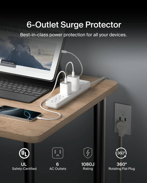 6 Outlet Surge Protector Power Strip Featuring A 360 Degree Rotating Plug And 6 Foot Cord on a modern desk with devices connected.