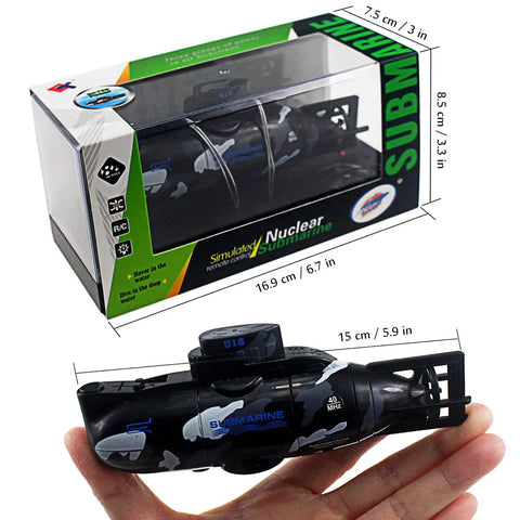Mini RC Submarine Remote Control Boat Waterproof Dive Toy Kid Friendly Awesome Realistic Military Model With Dive Function Go Forward Backward Turn Left Right Submerge And Float Black Gift shown in packaging and handheld for size reference.