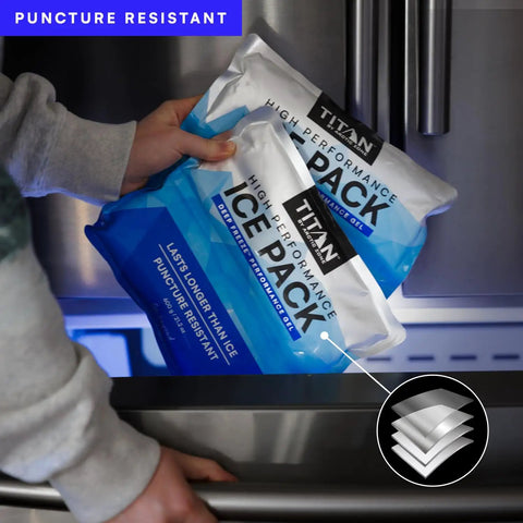 Person placing Deep Freeze Titan Ice Pack 2 Pack 600 Gram High Performance Puncture Resistant Cold Pack With Non Toxic Gel in freezer