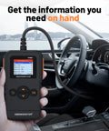 Universal OBD II Scanner for All Cars, Engine Fault Code Reader and CAN Diagnostic Tool held inside a car interior.