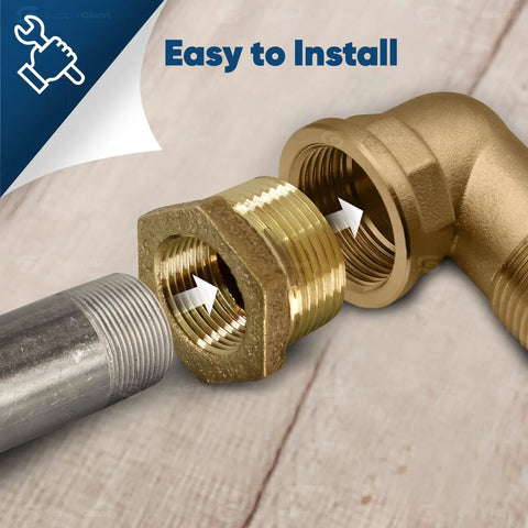 Close-up of brass NPT bushing, 1-1/4 in male x 1 in female, hex-head, lead-free brass, paired with gray threaded pipe