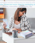 Woman using Dope Rainbow Holographic Bubble Mailers Self Seal Waterproof Envelopes 6 By 9.5 Inch 60 Pack for packaging.