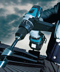 Hard Core Bad Boy 18V Cordless Hammer Driver Drill Kit Featuring 1/2 Inch Chuck And Two Speed Transmission in use with twisted drill bit