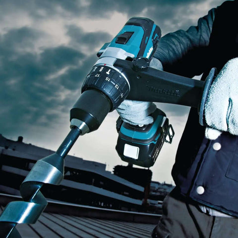 Hard Core Bad Boy 18V Cordless Hammer Driver Drill Kit Featuring 1/2 Inch Chuck And Two Speed Transmission in use with twisted drill bit