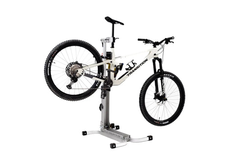 Bike Balance Trainer And Repair Stand Combo For Cyclists with mountain bike mounted on aluminum repair stand, 275 lb capacity.