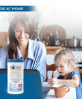 Woman and child at kitchen table with Alcohol-Free Disinfecting Wipes No Bleach Medical-Grade Multi-Surface Cleaning 80 Count canister