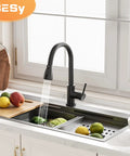 Brass Single Handle Kitchen Faucet With Pull Down Sprayer Matte Black High Arc Sink Faucet with water flowing over fruit