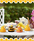10 Pack Unfinished Wood Beehive Decor Mini Beehives For DIY Paintable Honeycomb Farmhouse Tiered Tray And Garden Decor 1.8 x 1.9 Inch Small Craft Models For Table Shelf Sitter Party Craft displayed on table with tea set and flowers