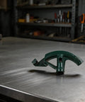 Sileduove Manual Pipe Bender For 3/4 Inch Tubes With Interchangeable Dies For Copper And Steel shown on metal workbench.