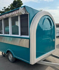 Rollout Ready Custom Towable Food Trailer Commercial Mobile Catering Kitchen With Insulated Walls Heavy Duty Chassis And Turnkey Layout showing rear and side view with awning.