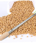 Grain Sampler Tool Stainless Steel Sampling Probe for Wheat Rice Sorghum next to spilled soybeans on white surface