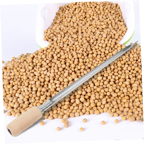 Grain Sampler Tool Stainless Steel Sampling Probe for Wheat Rice Sorghum next to spilled soybeans on white surface