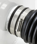 Close-up of PYI stainless steel worm-drive hose clamp on a black ribbed hose; 0.87–1.18 in (22–30 mm) size.