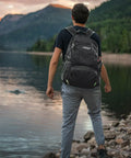 Person with 40L Lightweight Packable Hiking Backpack With Wet Pocket Waterproof Daypack For Travel Camping And Outdoor Adventures