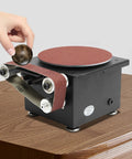 Mini Belt And Disc Sander, 100 Watt Bench Grinder with sanding belt and disc on a wooden table for DIY projects.