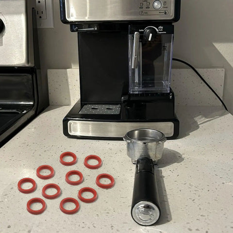 10 Pack Silicone Coffee Machine Seals for Espresso Makers Replacement Gaskets That Stop Leaks and Withstand High Heat Fits AEG Krups Siemens Melitta Miele and More Durable Easy Install Pro Grade Seal Kit, red silicone gasket rings beside espresso machine portafilter