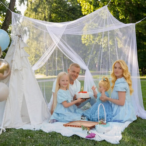 Family enjoying picnic under Four Corner Bed Mosquito Net For Canopies And Travel, Rectangular Mesh Netting in a garden setting