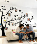 Living room with 3D Dope Tree Wall Decals With DIY Photo Frame For Family Portraits Tree Wall Murals, cozy decor, family seated on sofa