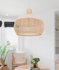Rattan Chandelier 1 Light Boho Coastal Wicker Handwoven Pendant Light For Kitchen Dining Room Restaurants 15.74 Inch Wide 15.74 Inch High Eco Friendly Natural Material With White Accent Stripes hanging in a bright room