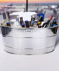 Aspen Heavy-Duty Oval Stainless Steel Drink Cooler For Parties 25-Quart Large Ice Bucket filled with bottles outdoors