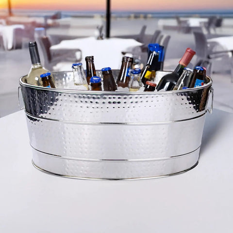 Aspen Heavy-Duty Oval Stainless Steel Drink Cooler For Parties 25-Quart Large Ice Bucket filled with bottles outdoors