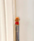Whimsical Dog Themed Door Hinge Heads Set Of 6 Magnetic Toppers For Metal Surfaces installed on door hinge.