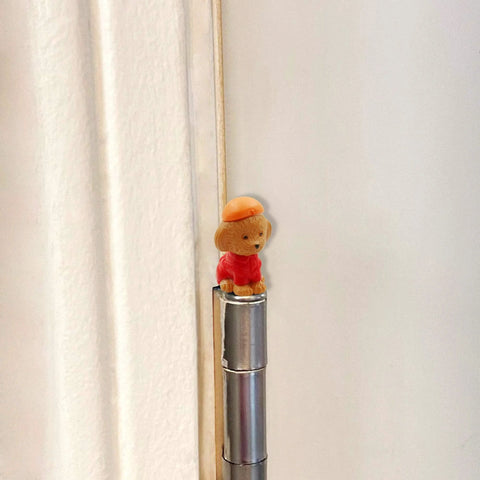 Whimsical Dog Themed Door Hinge Heads Set Of 6 Magnetic Toppers For Metal Surfaces installed on door hinge.