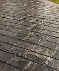 Top Shelf Pro Grade High Gloss Wet Look Concrete Sealer That Really Gonna Make Your Driveway Shine With Hard Hitting Protection And Deep Color Enhancement For A Solid Five Gallon Finish on stamped concrete surface.