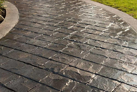Top Shelf Pro Grade High Gloss Wet Look Concrete Sealer That Really Gonna Make Your Driveway Shine With Hard Hitting Protection And Deep Color Enhancement For A Solid Five Gallon Finish on stamped concrete surface.