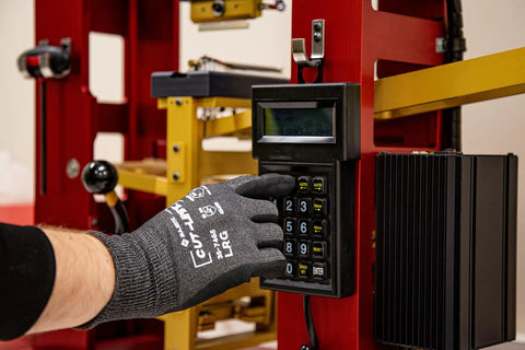Cut-Less Korplex Glove With Foam Nitrile Palm For Cut Resistance And Dexterity Touch Screen Compatible in use on keypad.