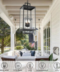 Large Twenty Five Inch Outdoor Pendant Light With Clear Glass And Sturdy Metal Build hanging on porch with cozy seating.