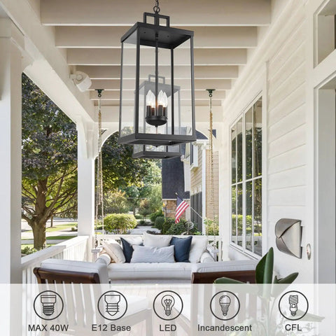 Large Twenty Five Inch Outdoor Pendant Light With Clear Glass And Sturdy Metal Build hanging on porch with cozy seating.