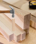 Wooden Dowel Pins Pack Of 120 Three Eighths Inch By One And A Half Inch Straight Grooved Pins With Beveled Ends on a workbench