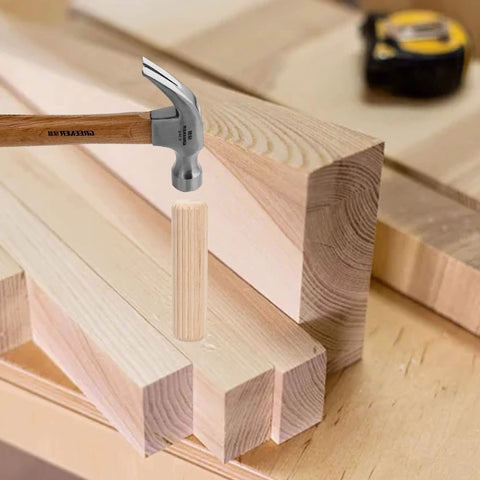 Wooden Dowel Pins Pack Of 120 Three Eighths Inch By One And A Half Inch Straight Grooved Pins With Beveled Ends on a workbench