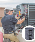 Technician installing Top Shelf Outdoor AC Compressor Soundproofing Foam Wrap With Heavy Duty Straps And Self Adhesive Insulation Blanket.