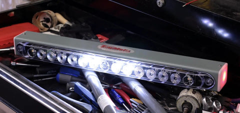 Advantage Wireless Tow Light Bar 22 Inch LED Magnetic Trailer Light Kit on a workbench with tools and accessories