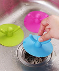 Green Shape Floor Drain Plug shown in use, ideal for sinks; 9.50cm diameter, leakproof design with fun small person shape.