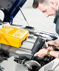 Heavy Duty Half Inch Air Impact Wrench Kit With Twin Hammer shown being used on car engine, tool box in background