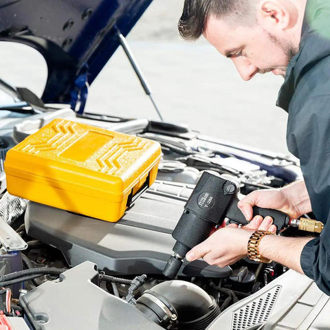 Heavy Duty Half Inch Air Impact Wrench Kit With Twin Hammer shown being used on car engine, tool box in background