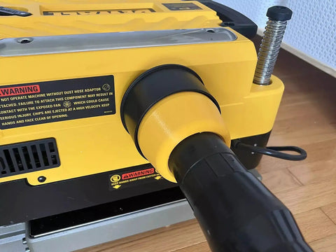 Close-up of Two And A Half Inch Hose Adapter For Planer Dust Port Fits 735 And 735X Quick Friction Fit Secure Connection on planer.