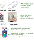Remote control and accessories of RGB Under Cabinet Lights Kit With Wireless RF Remote And Dimmable LED Puck Lights.