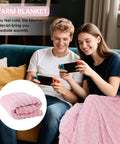 Couple using Two In One Travel Blanket And Pillow Ultra Soft And Compact For Airplane Travel With Luggage Strap And Clip Pink 61 By 43 Inches.