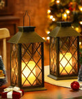 Two bronze metal leaf pattern solar lanterns on a table, lit at night, Solar Lanterns Outdoor Waterproof Garden Lanterns With Metal Leaf Pattern Dusk To Dawn Solar Powered Hanging Lights For Patio Garden Table Decor Great Mothers Day Gift For Mom Wife Grandma. Decor, gift box, and mini trees around.