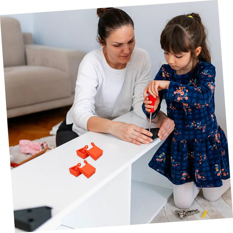 Child and adult assembling furniture with four piece woodworking strap clamp blocks in home workshop setting