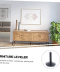 Heavy Duty Adjustable Furniture Levelers With Swivel Base For Tables And Cabinets installed under a wooden cabinet in a living room setting.