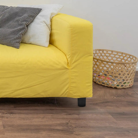 Yellow sofa with visible leg from 4 Pack Round Furniture Leg Replacement Set for Chairs and Tables, Plastic and Metal Design.