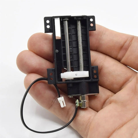 Precision Linear Actuator With Planetary Gear Stepper Motor 6mm Screw 30mm Stroke 2 Phase 4 Wire in hand, showcasing compact design.